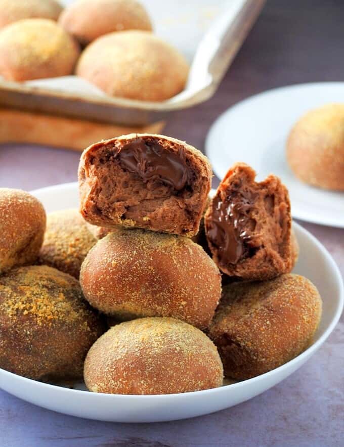 chocolate pandesal on a white plate