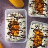 Mango Bravo Cake in a plastic tub