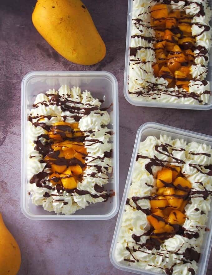 Mango Bravo Cake in a plastic tub