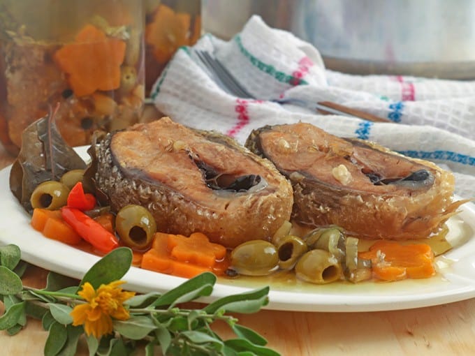 homemade sardines bangus on a white serving platter