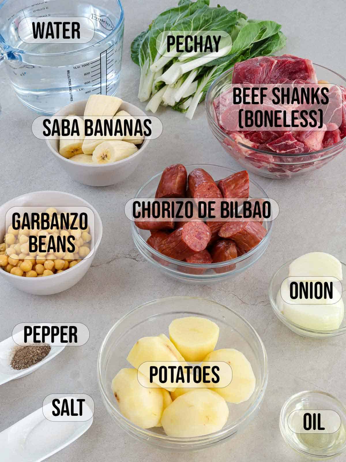cocido ingredients in glass bowls.