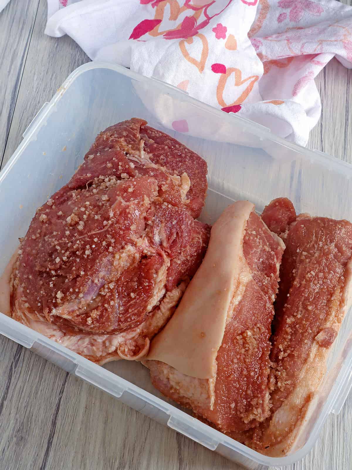 pork ham ready to cure in a container