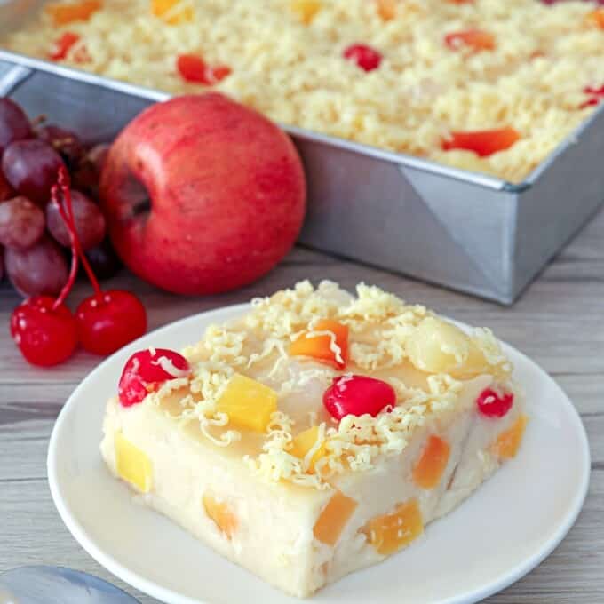 slice of fruity maja blanca on a white serving plate