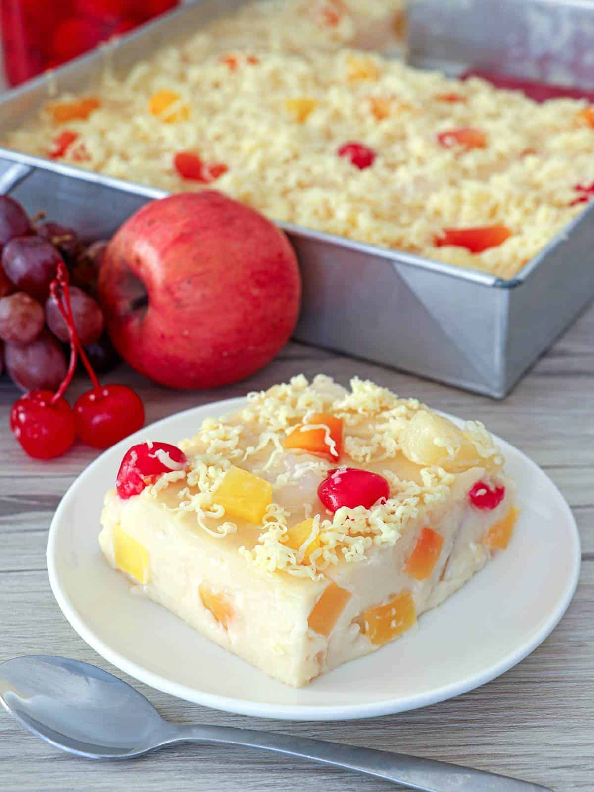 slice of fruity maja blanca on a white serving plate