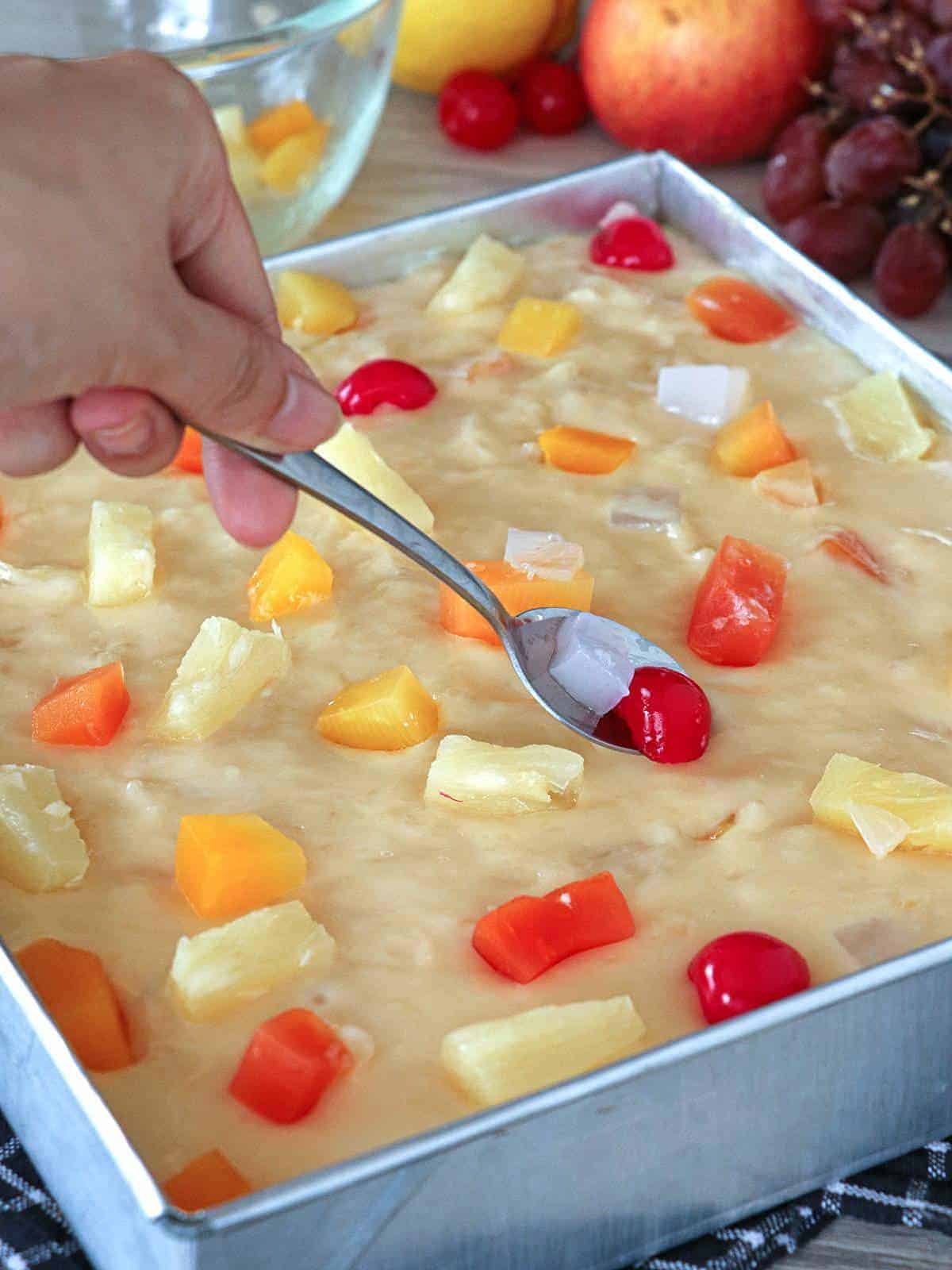 topping fruity maja blanca in a pan with fruits