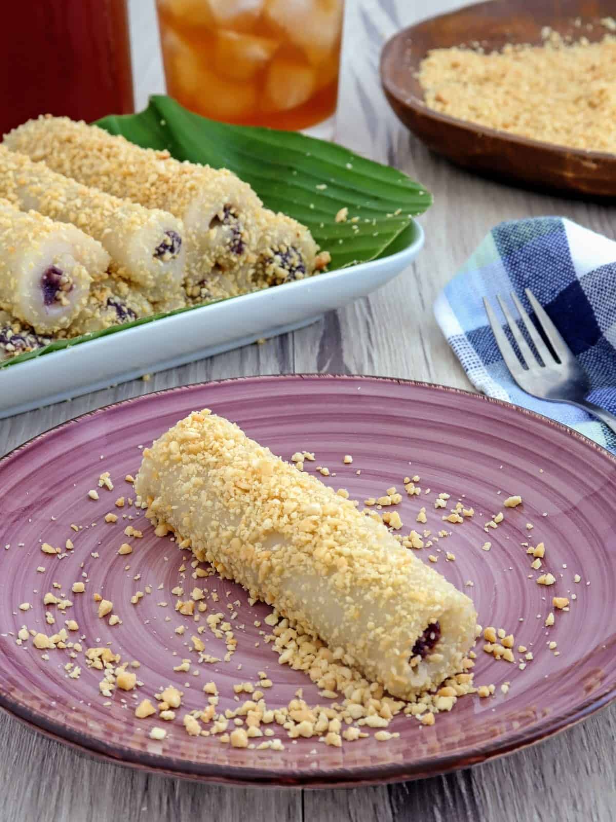 Peanut Tikoy Rolls with ube halaya filling on a serving plate