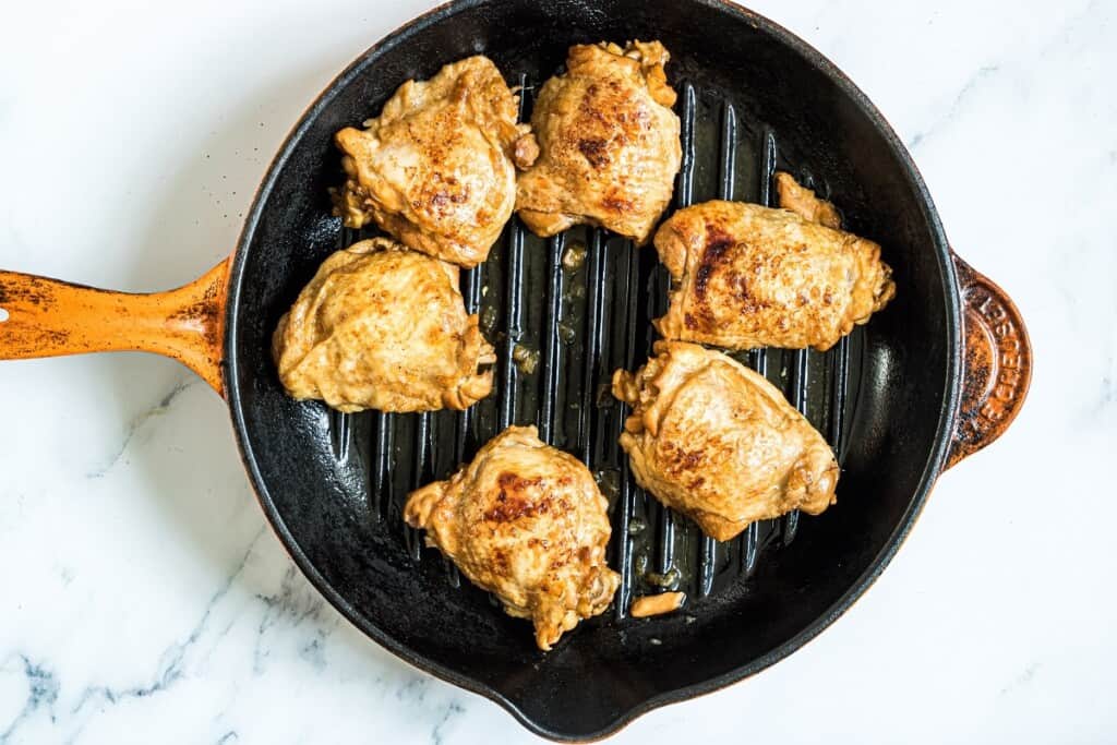 chicken adobo on a grill pan to broil