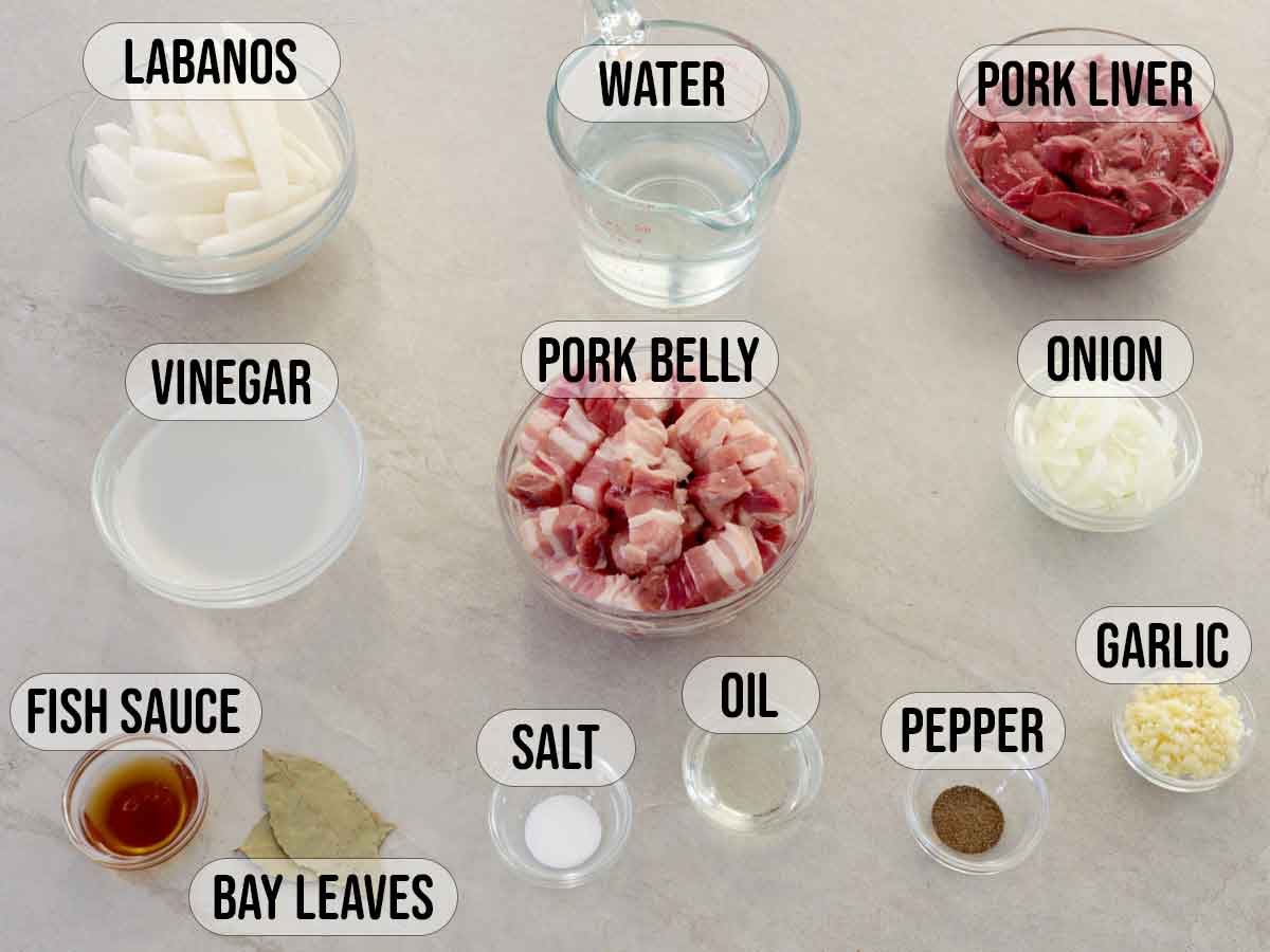 ingredients for Kilawing Labanos at Baboy in glass bowls.