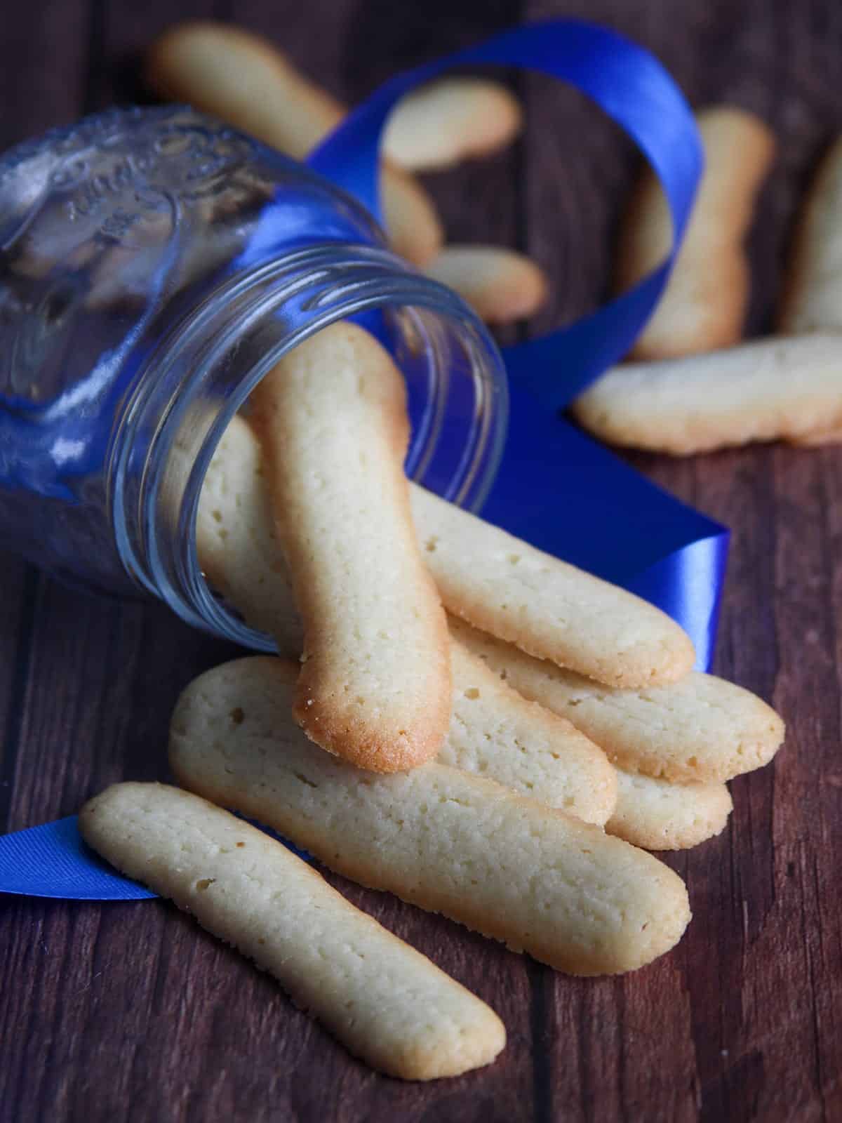 Filipino cat's tongue cookies in a glass jar
