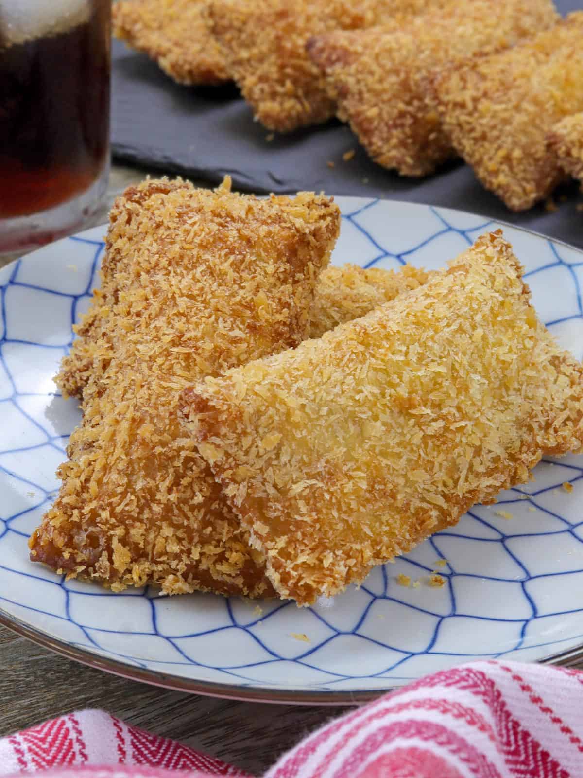 Crispy Tuna Pies on a blue and white plate.