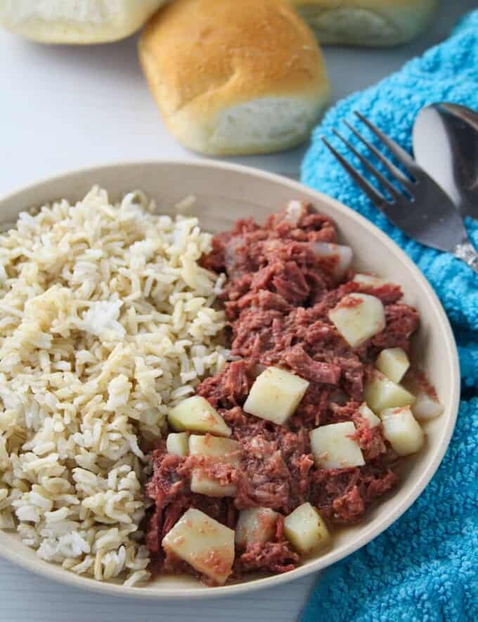 corned beef guisado with steamed rice on a serving plate