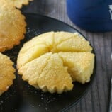 sliced Cebuana Torta Mamon Cake on a black serving platter