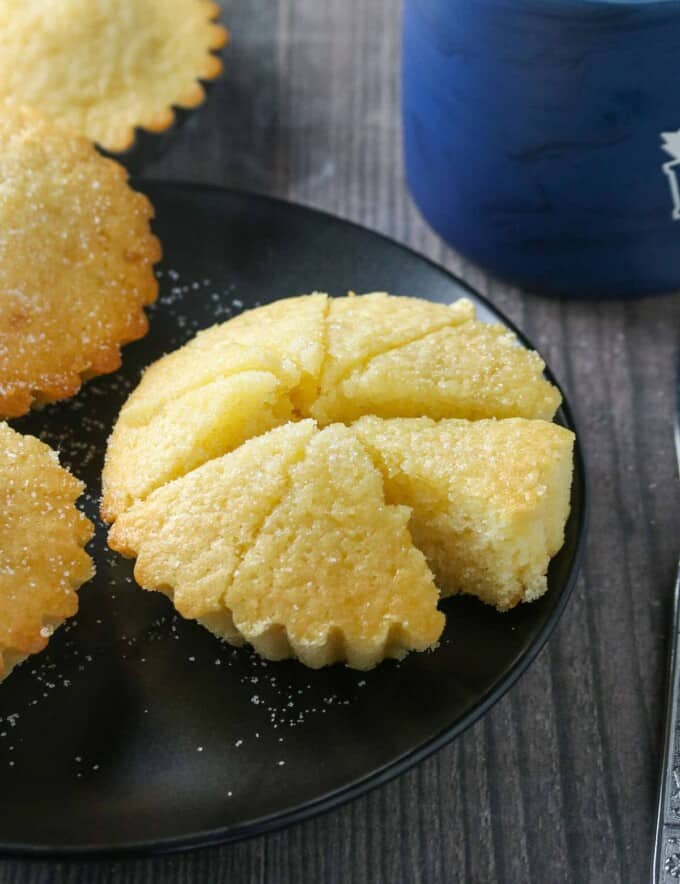 sliced Cebuana Torta Mamon Cake on a black serving platter