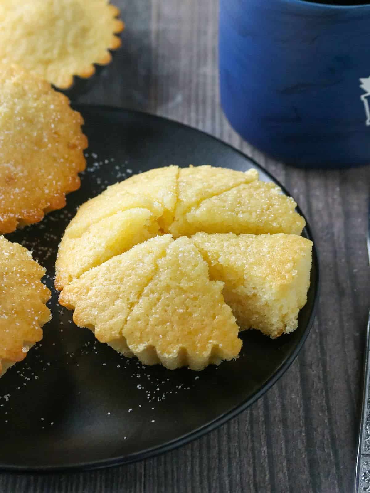 sliced Cebuana Torta Mamon Cake on a black serving platter