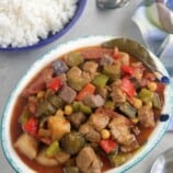 Waknatoy on a serving platter with a plate of steamed rice on the side