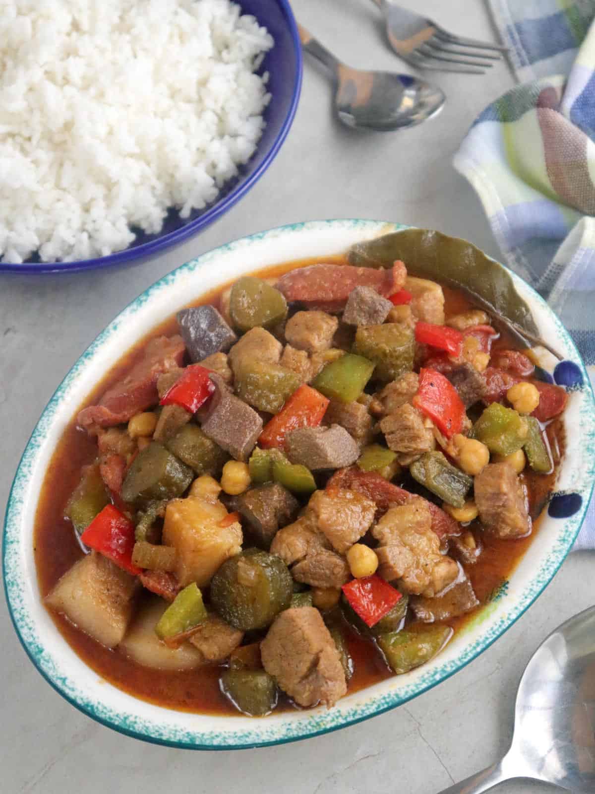 Waknatoy on a serving platter with a plate of steamed rice on the side