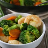 broccoli and shrimp stir-fry in a white bowl