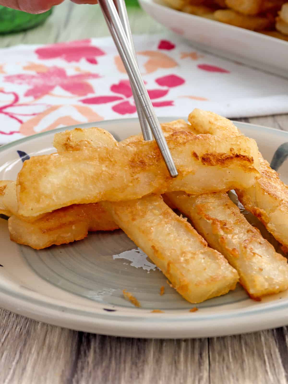 serving tikoy with a chopstick