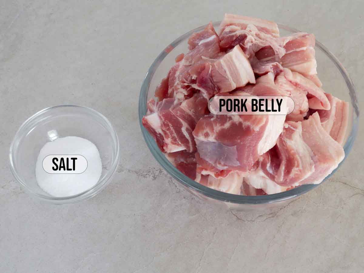 pork belly slices and salt in bowls.