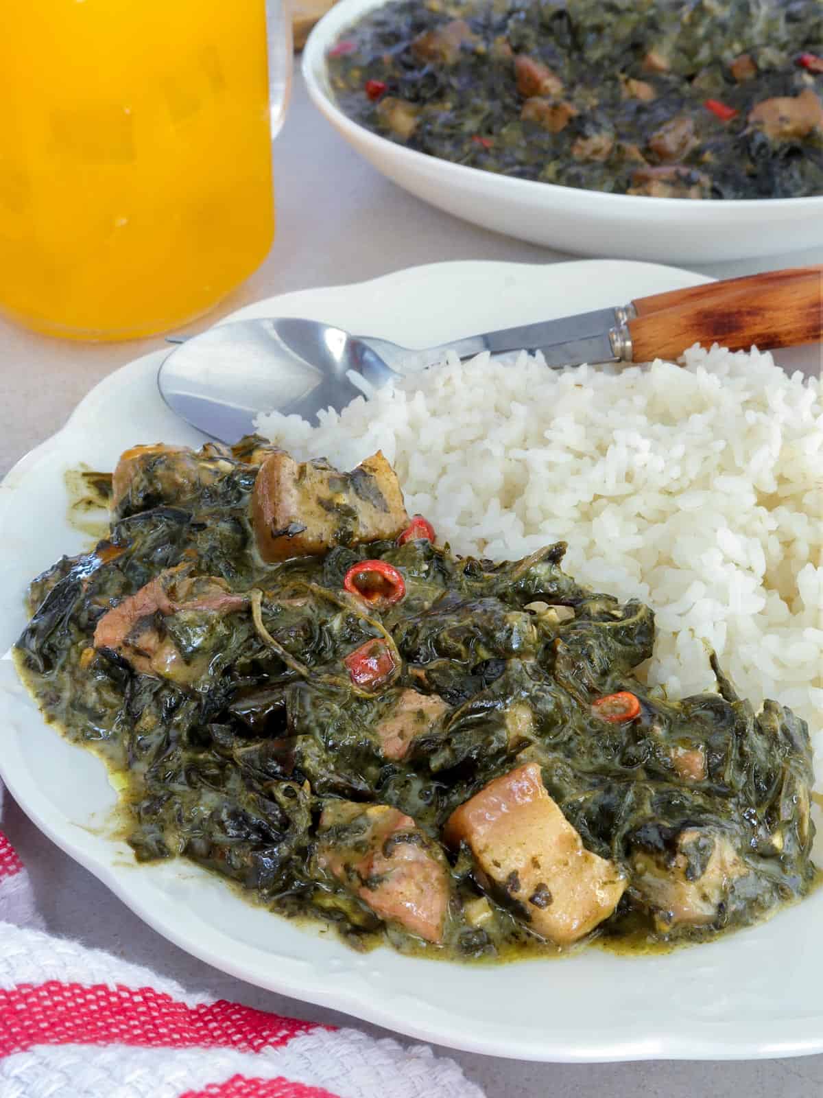 laing on a white plate with steamed rice