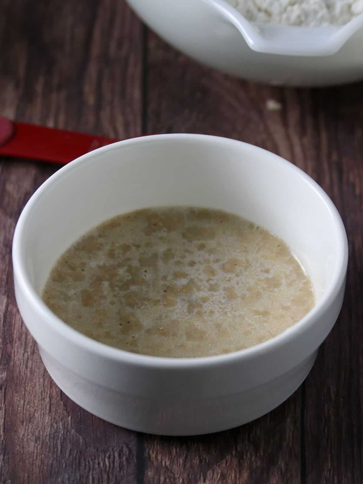 proofing yeast in a white bowl.proofing yeast in a white bowl.