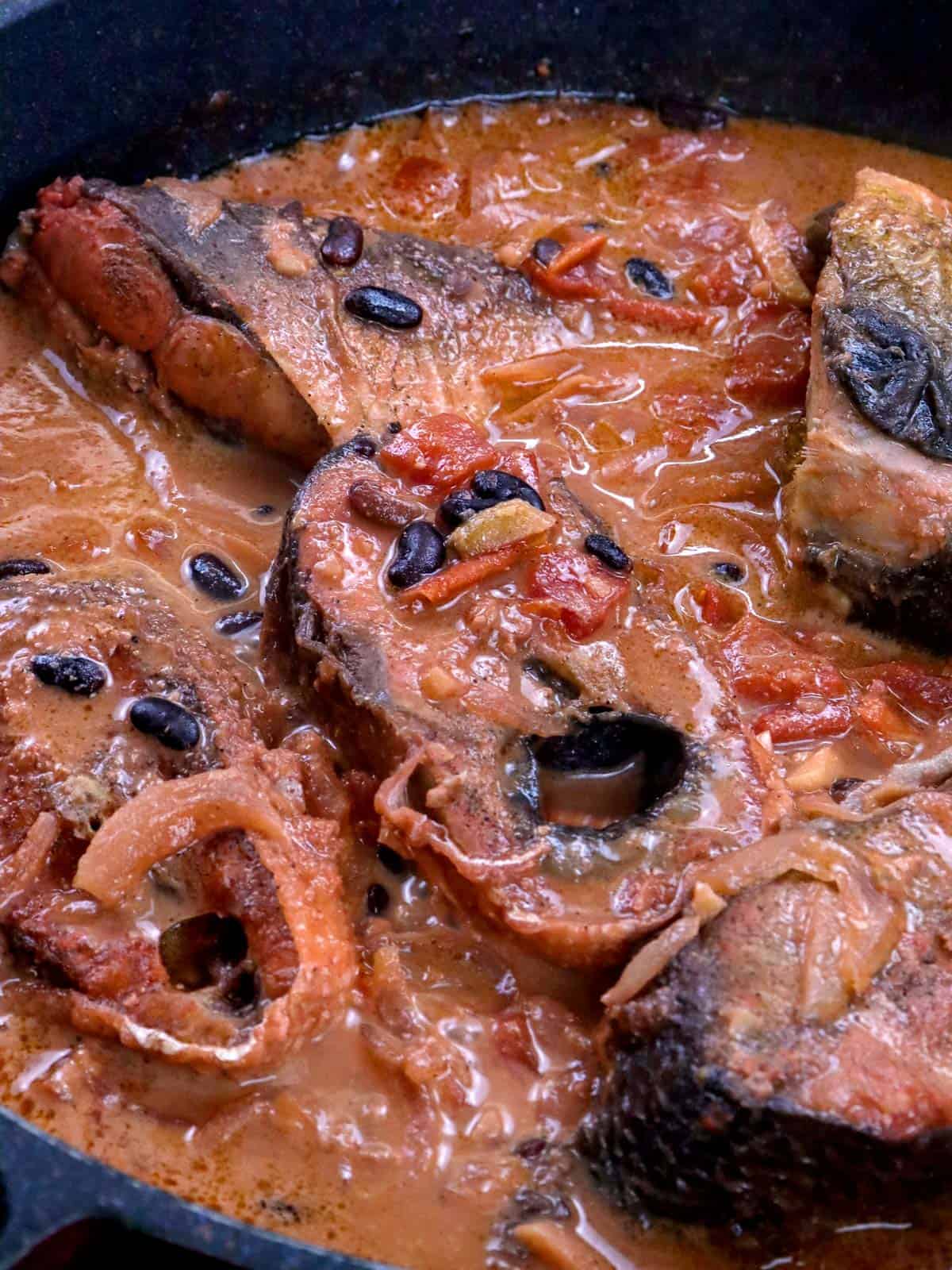 tochong bangus with tausi cooked in a pan