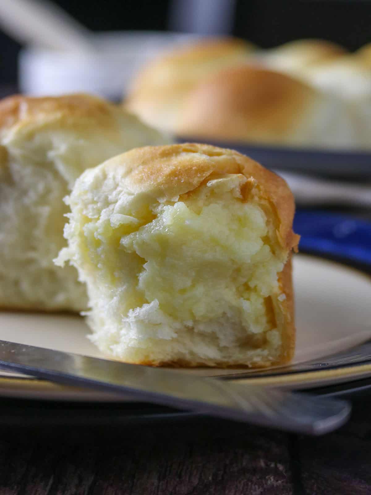 custard buns on a white plate.