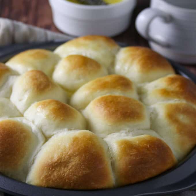 Yema Bread Rolls in a round baking pan.