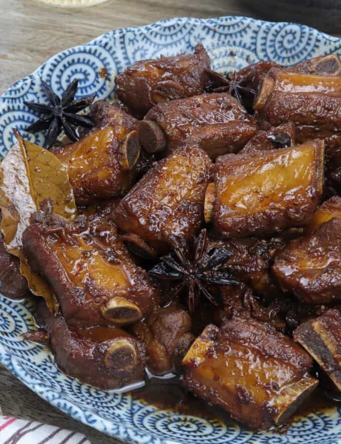 Chinese pork asado in a blue serving bowl.