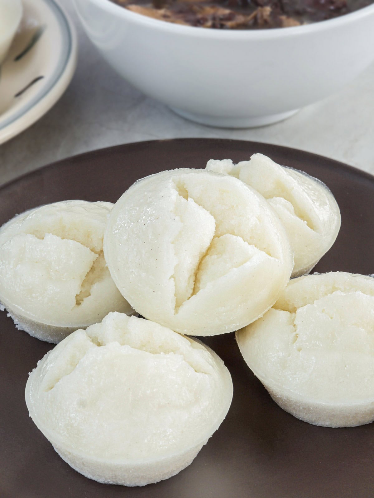 puto on a wooden serving plate.