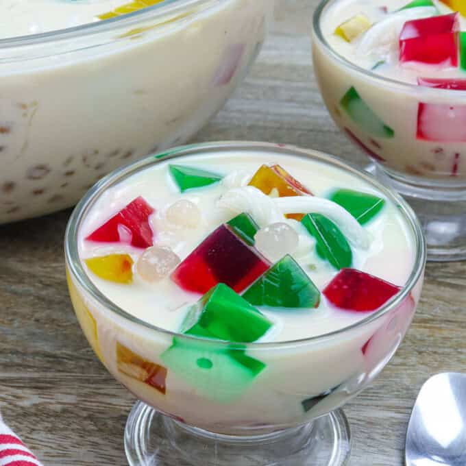 Buko Sago Jelly Salad in glasses with big bowl in the background.