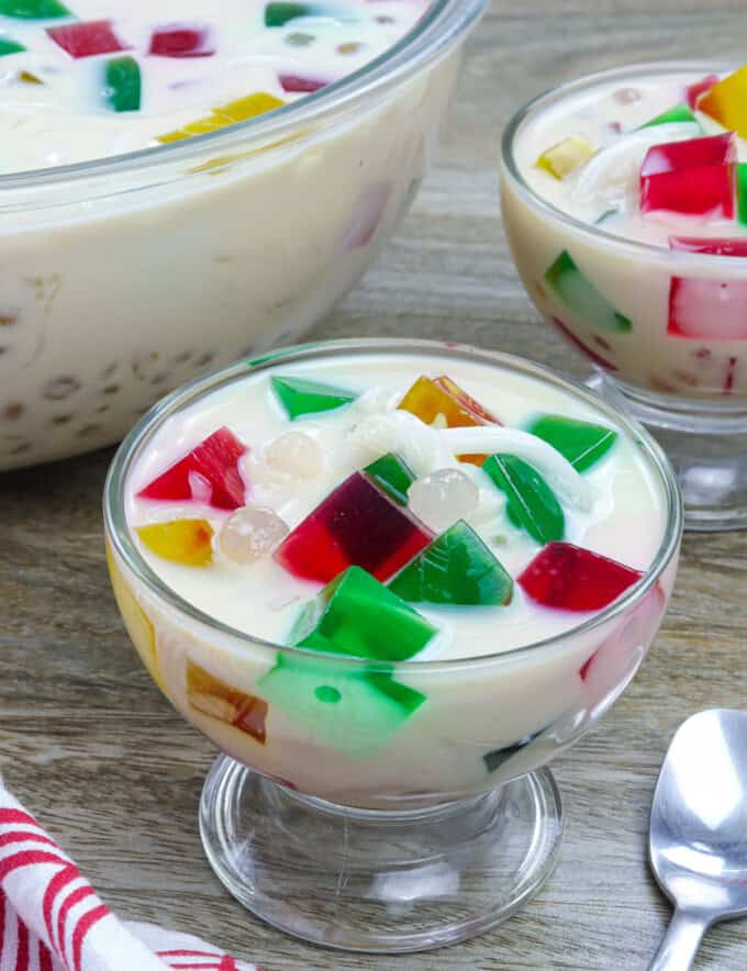 Buko Sago Jelly Salad in glasses with big bowl in the background.