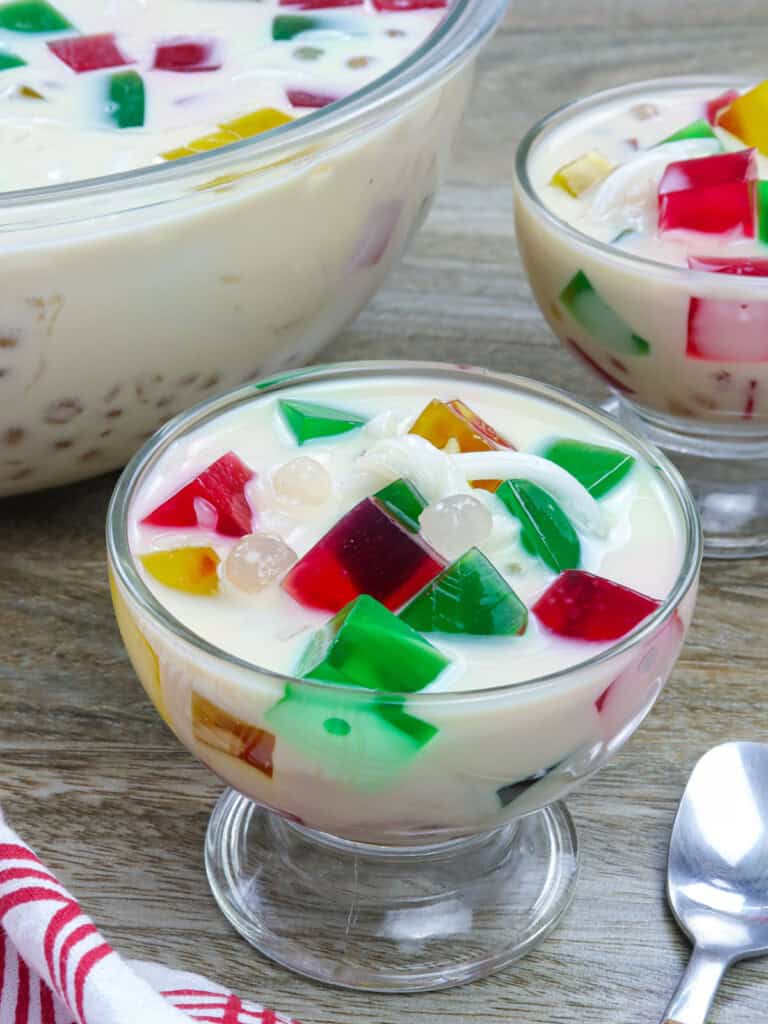 Buko Sago Jelly Salad in glasses with big bowl in the background.