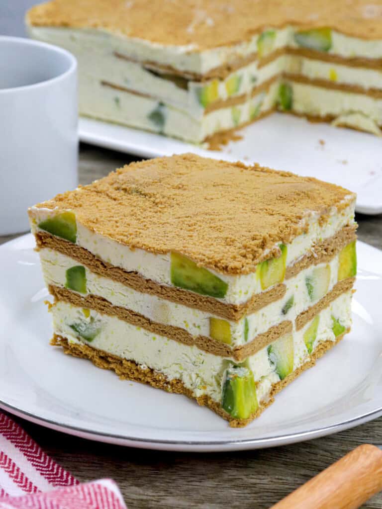 slice of avocado graham cake on a white plate.