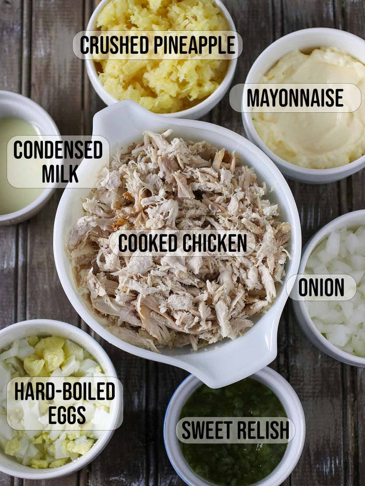 shredded chicken, chopped eggs, crushed pineapple, sweet relish in bowls.