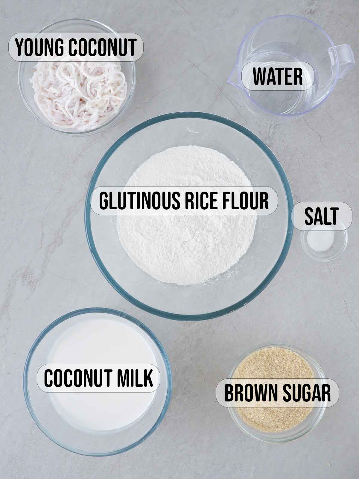 glutinous rice flour, water, brown sugar, buko, salt, coconut milk in bowls.