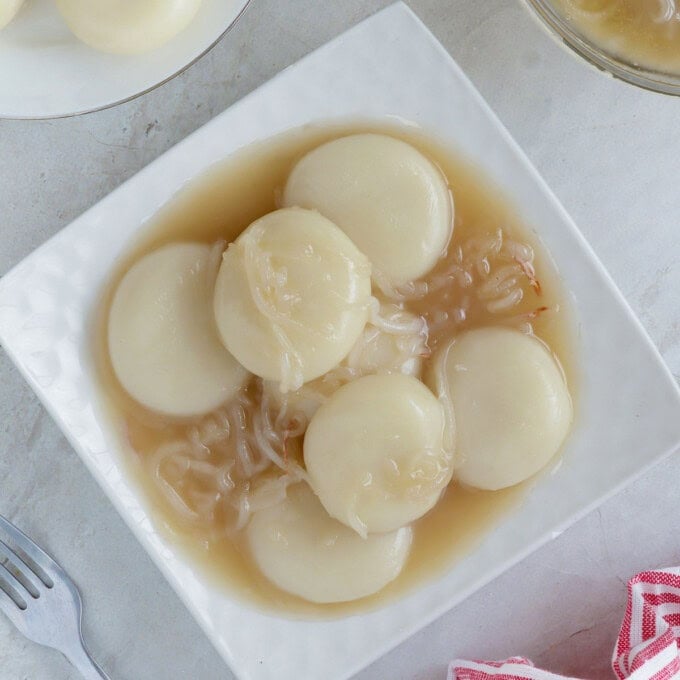 Inday-Inday with coconut sauce on a white serving platter.