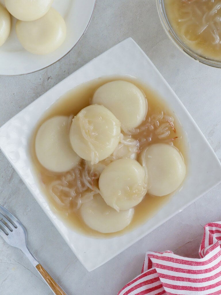 Inday-Inday with coconut sauce on a white serving platter.