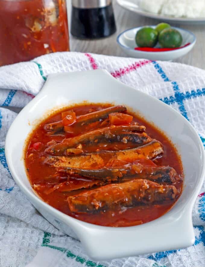 sardines in tomato sauce in a white serving bowl.